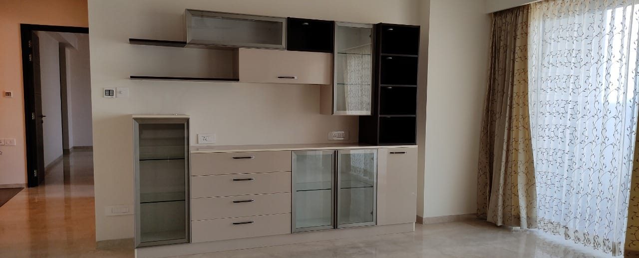 Media and crockery unit with display shelving, by Padmodya Interiors