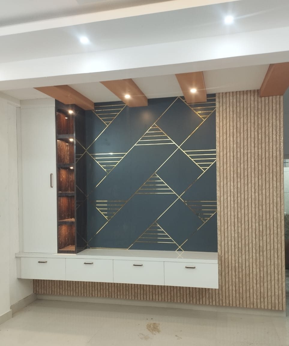 Television panel with brass inlay, by Padmodya Interiors