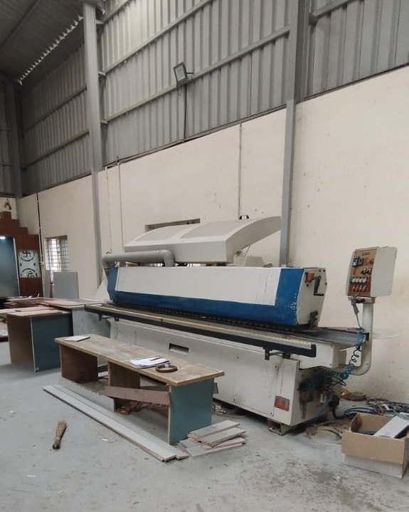 Edge-banding machinery on the Padmodya workshop floor