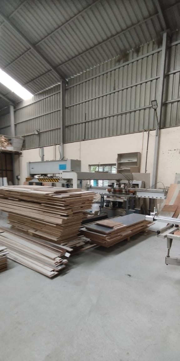 Cut panels stacked and staged for assembly